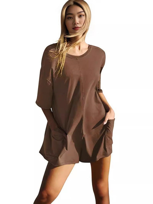 URHER brown relaxed fit short sleeve jumpsuit with pockets, worn by a woman.