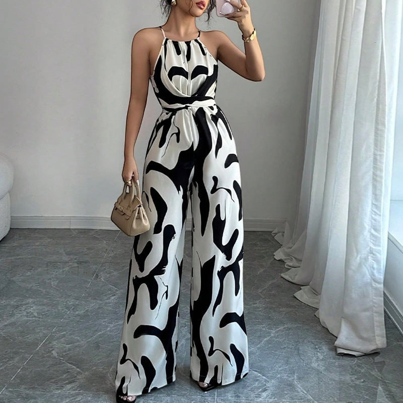 URHER Nia Utility Jumpsuit: black and white abstract print halter neck wide-leg jumpsuit with tie waist.