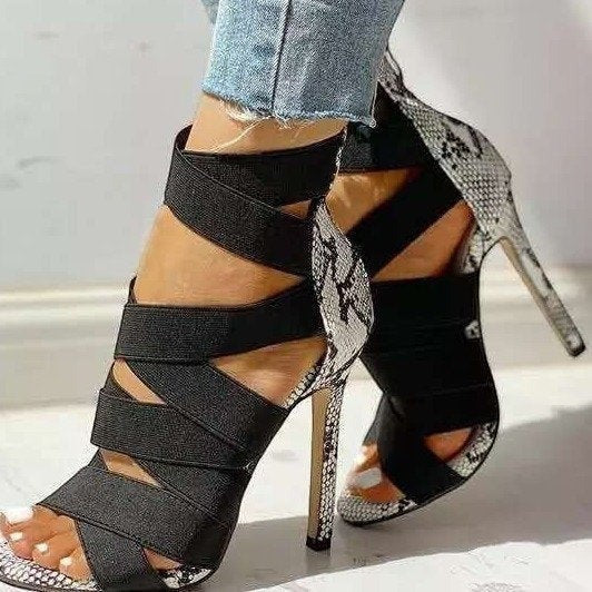 URHER Odette black cross strap snake print stiletto heel sandals with rear zipper.