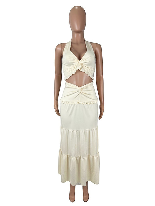 URHER Nadia V-neck twist-knot two-piece dress in cream polyester. Halter crop top with knot detail and tiered midi skirt.