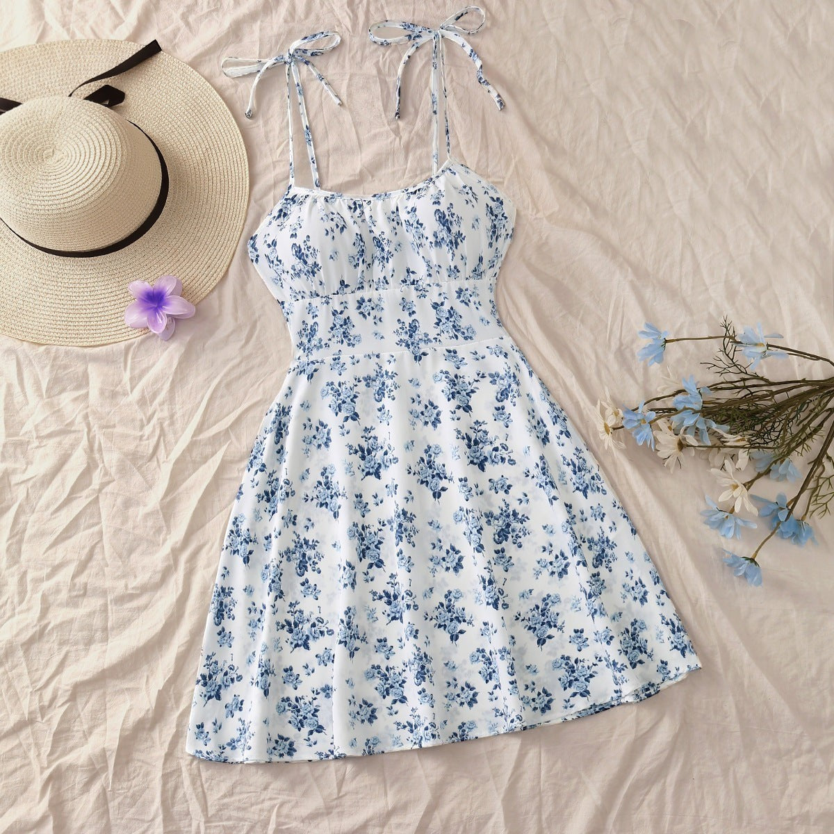 URHER floral print sundress with elastic waist and tie straps, white with blue flowers.