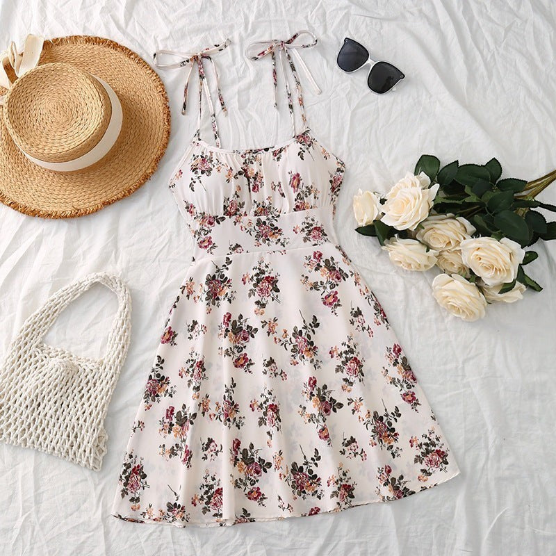 URHER Flora floral print sundress with elastic waist and tie straps. White with pink and burgundy floral pattern.