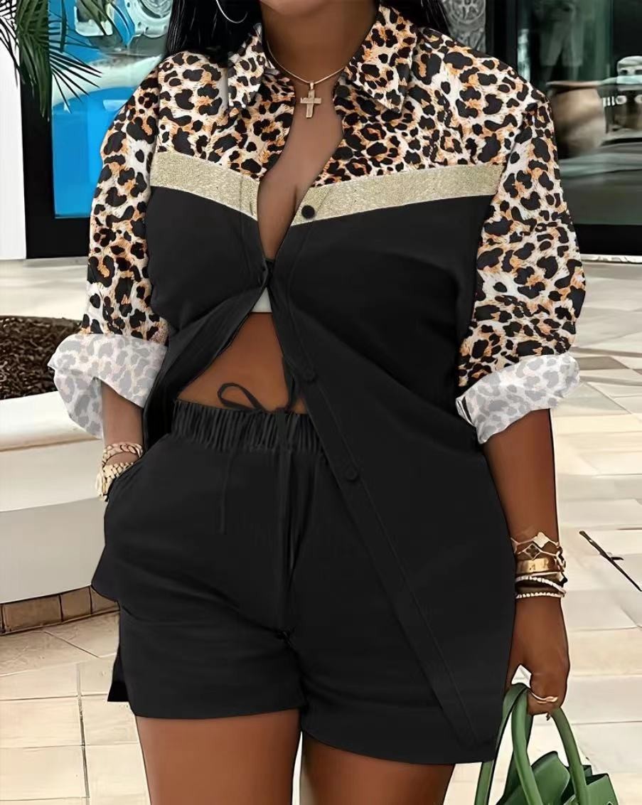 URHER Soleil Printed Two-Piece Set: black shorts and a long sleeve top with leopard print and gold stripe detail.