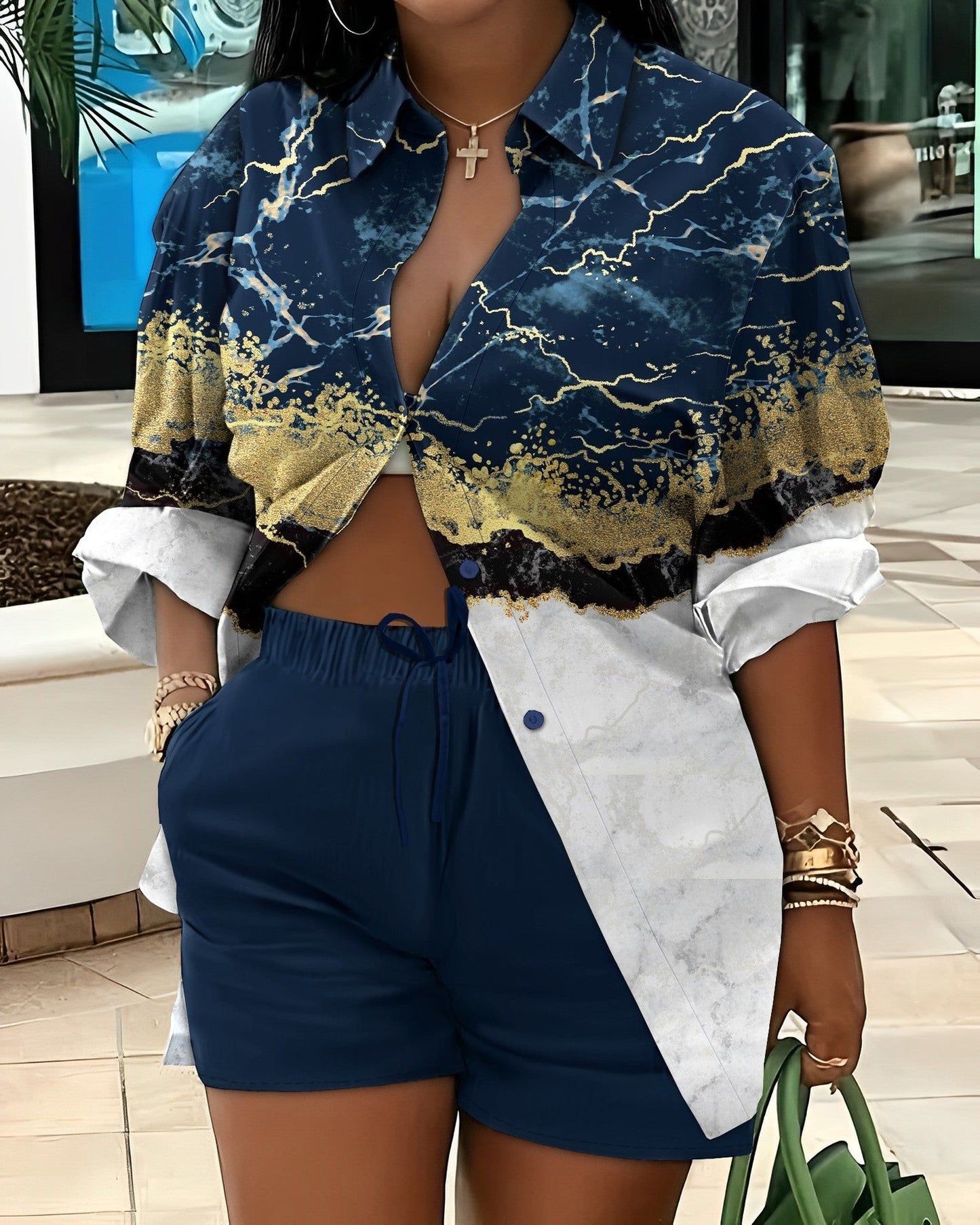 URHER Soleil Printed Two-Piece Set: Navy blue shorts and a long-sleeve collared shirt with a marble and gold abstract print.