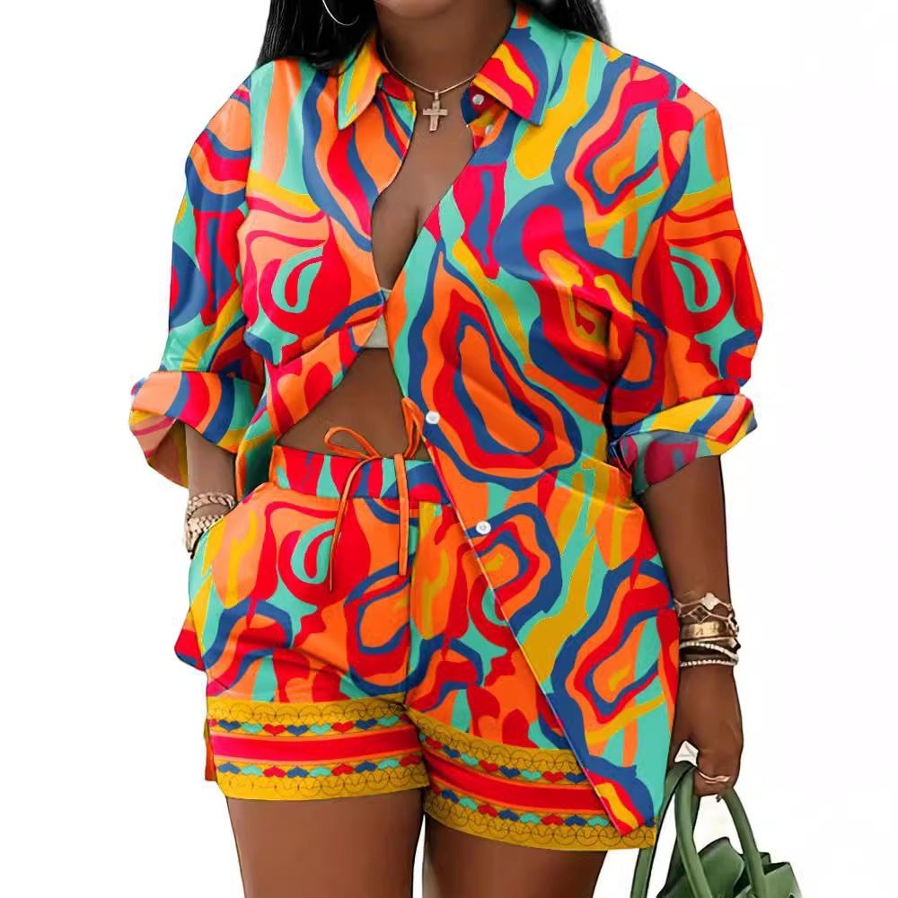 URHER Soleil Printed Two-Piece Set: long sleeve collared shirt and matching shorts in vibrant abstract print. Orange, red, blue, yellow, and teal.