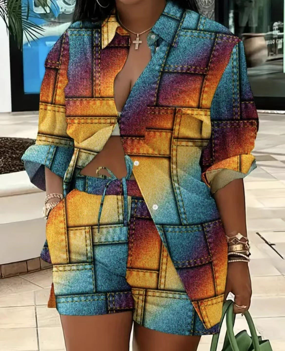 URHER Soleil printed two-piece set with long sleeve collared shirt and shorts in a patchwork denim-inspired design with rainbow colors.