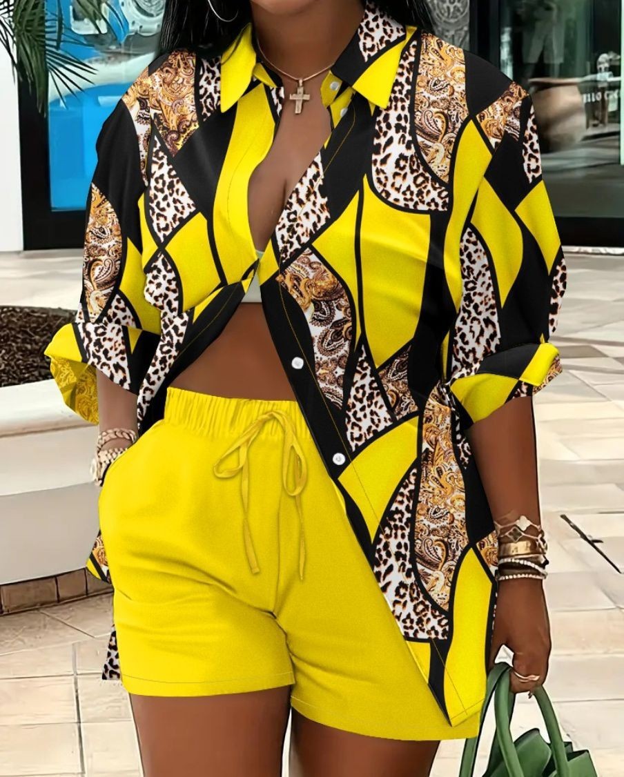 URHER Soleil printed two-piece set with yellow shorts and a black and yellow patterned long-sleeve shirt.