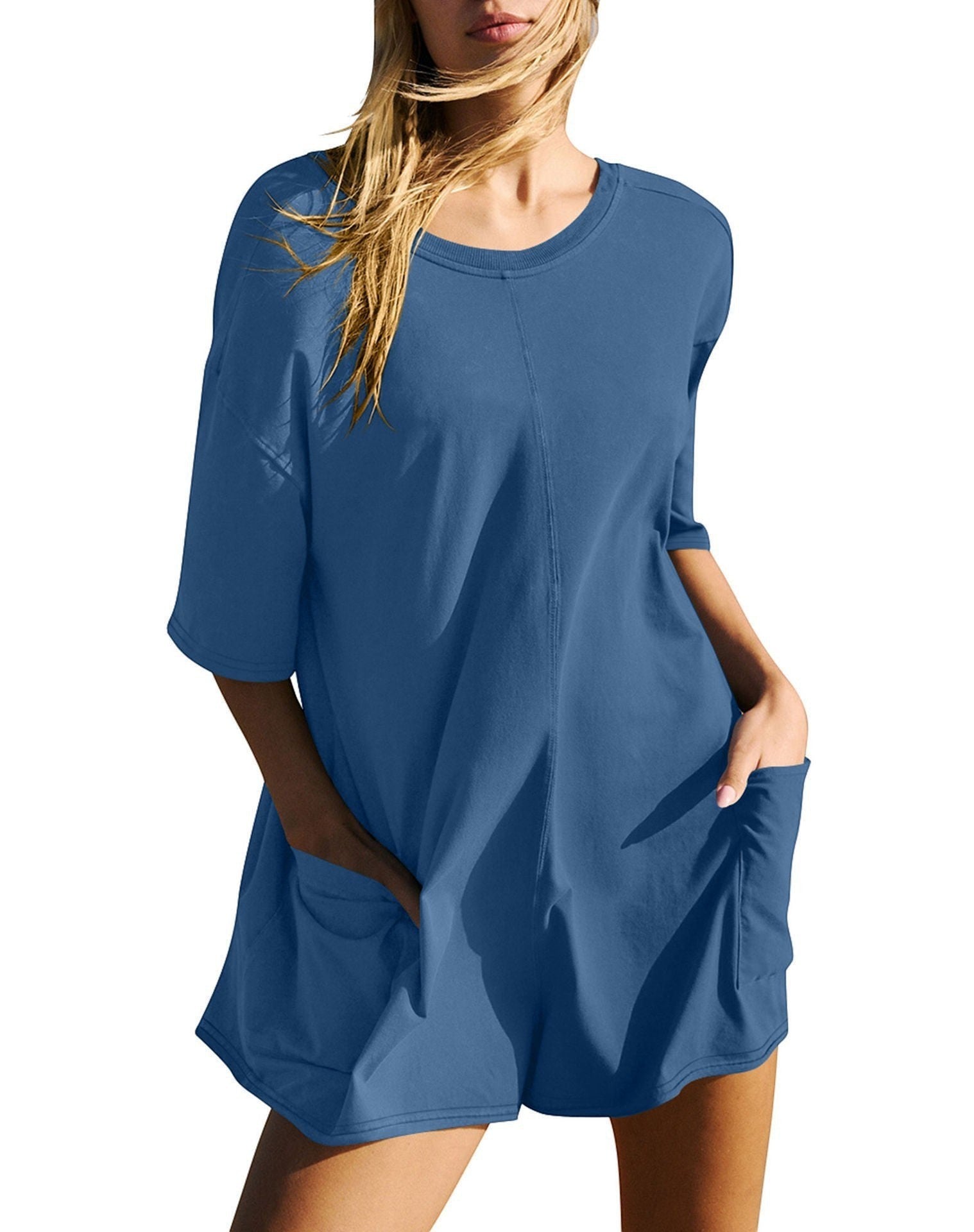 URHERE Imani Easy Jumpsuit in blue cotton blend with relaxed fit and side pockets. Model wearing a casual one-piece.